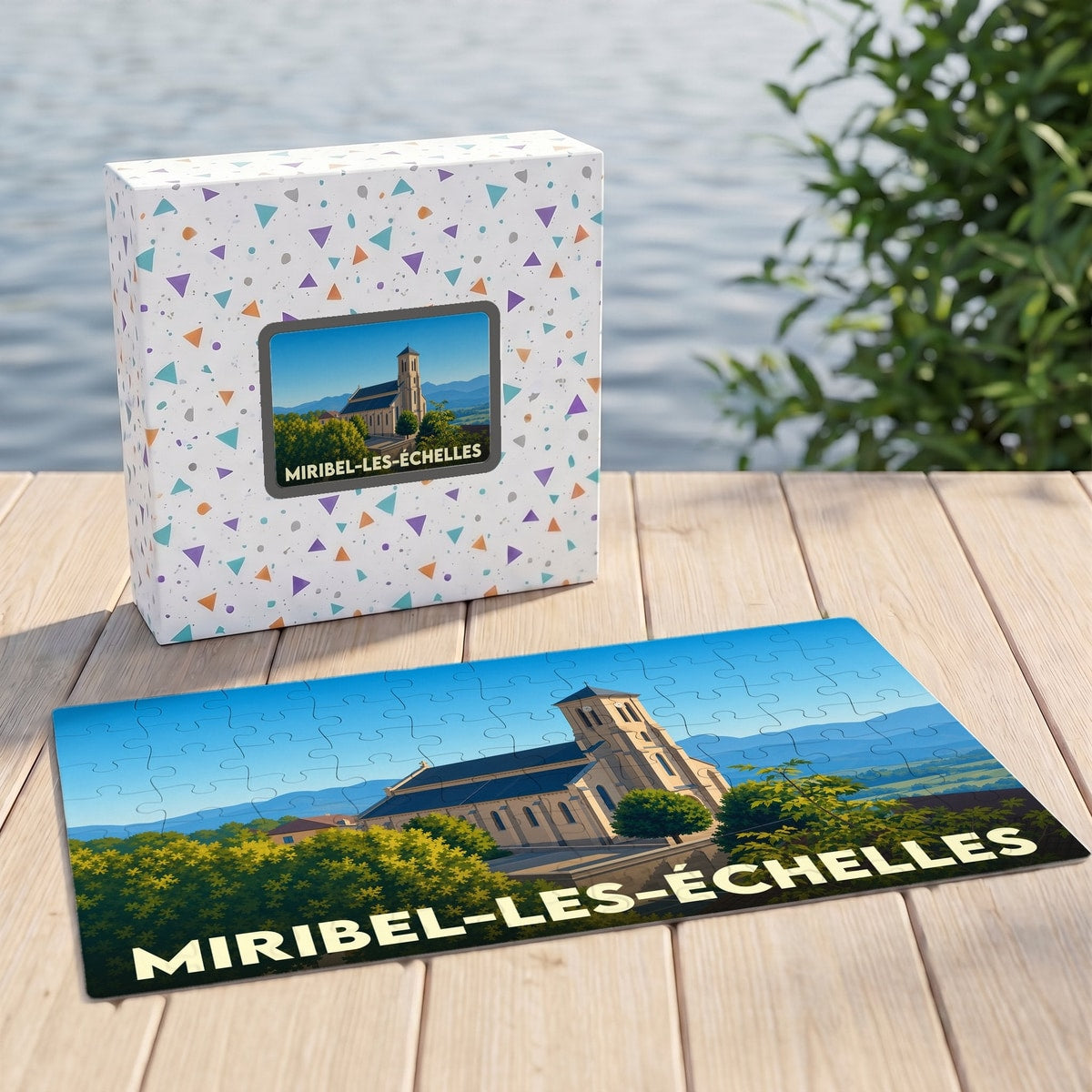 Puzzle souvenir de la ville de Miribel-les-Échelles avec une illustration stylisée d'une église sur fond de montagnes.