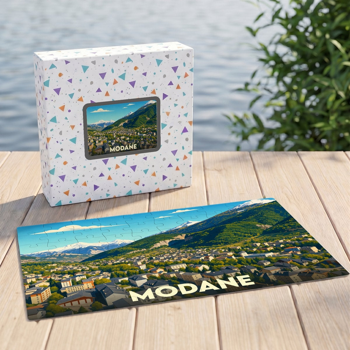 Puzzle souvenir de la ville de Modane avec une illustration stylisée de ses montagnes et habitations.