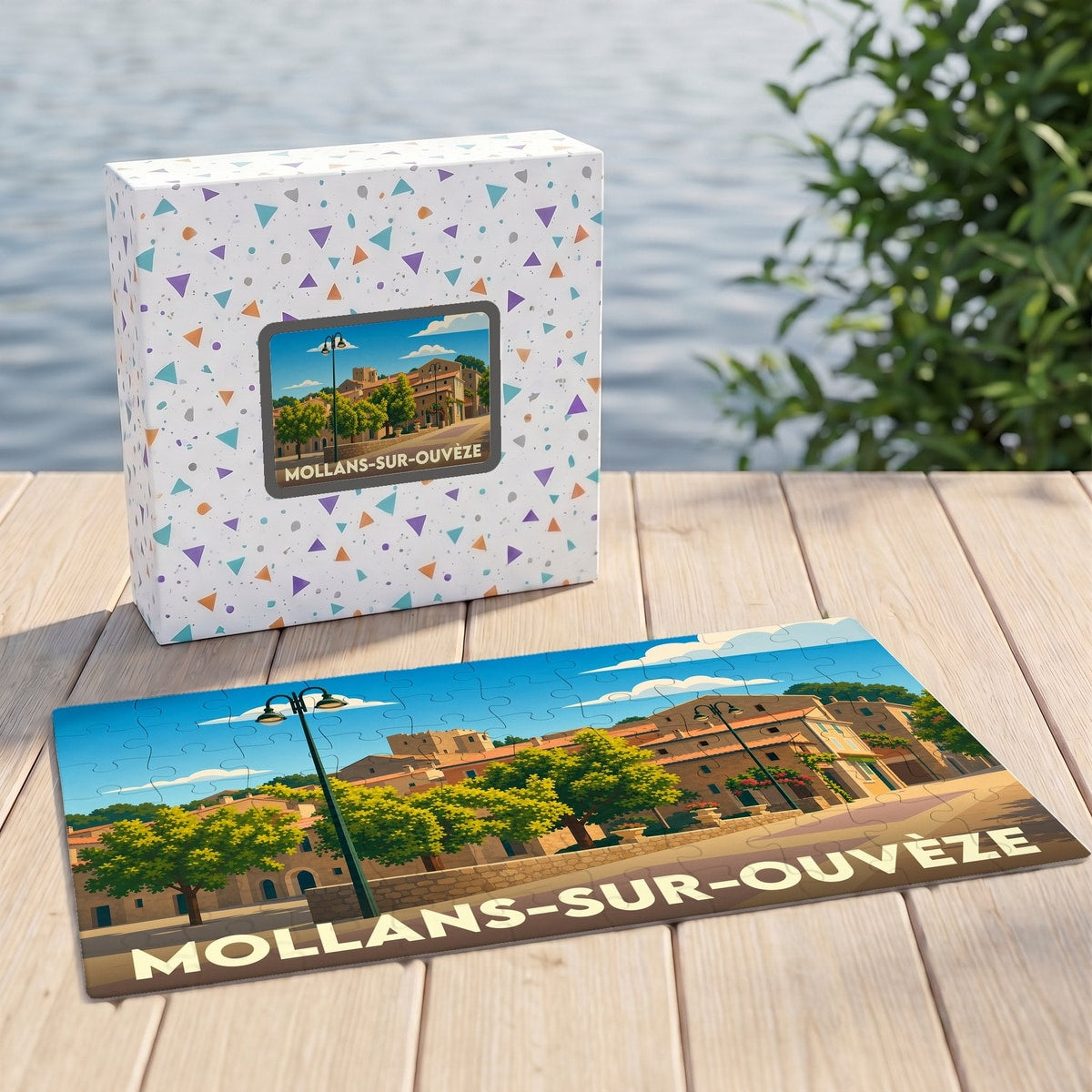 Puzzle souvenir de la ville de Mollans-sur-Ouvèze avec une illustration stylisée et sa boîte assortie.