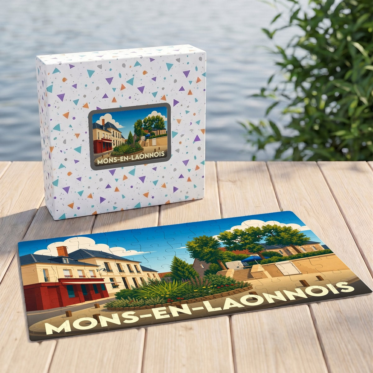 Puzzle souvenir de la ville de Mons-en-Laonnois avec une illustration stylisée d'une place de village.