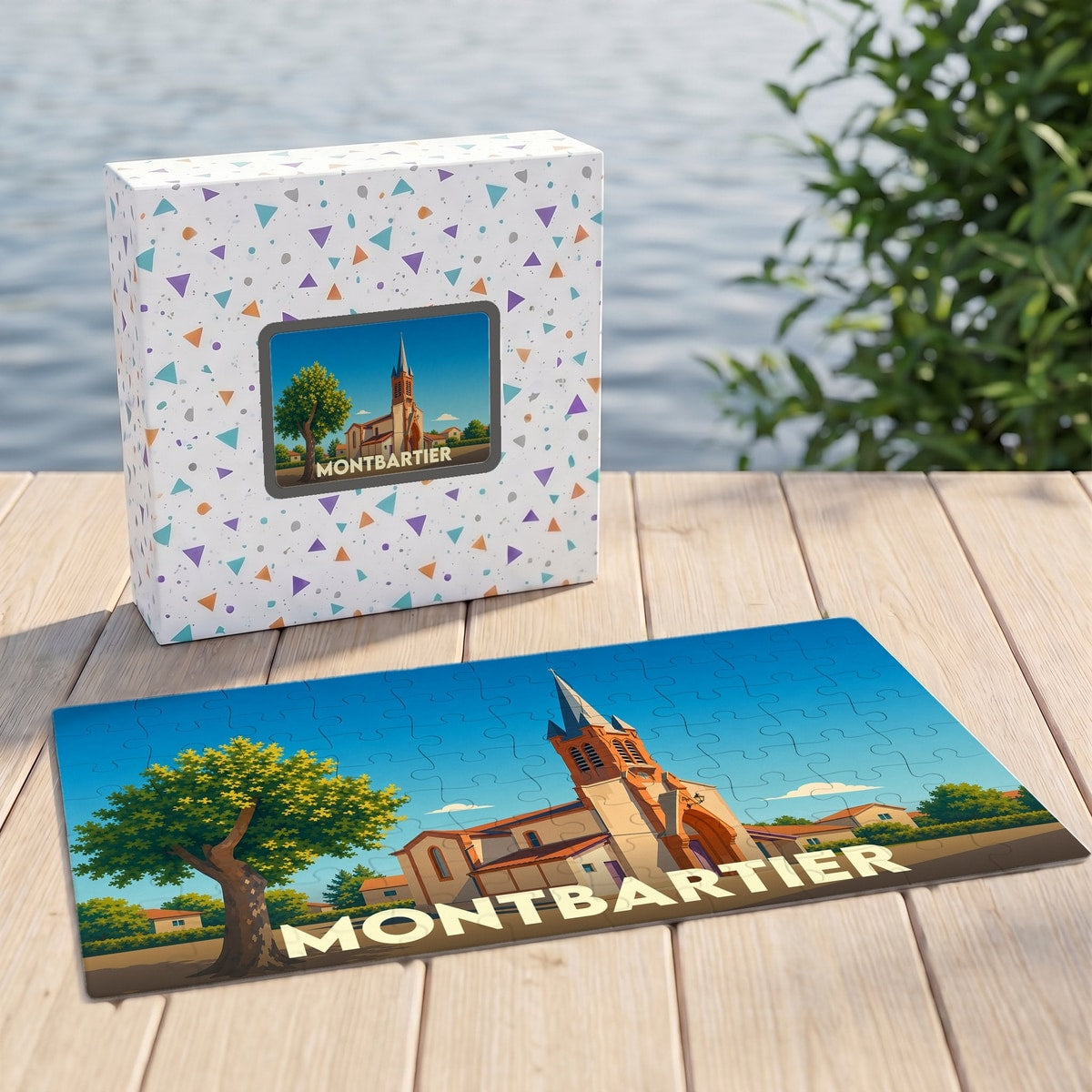 Puzzle souvenir de la ville de Montbartier avec une illustration stylisée d'une église sous un ciel bleu.
