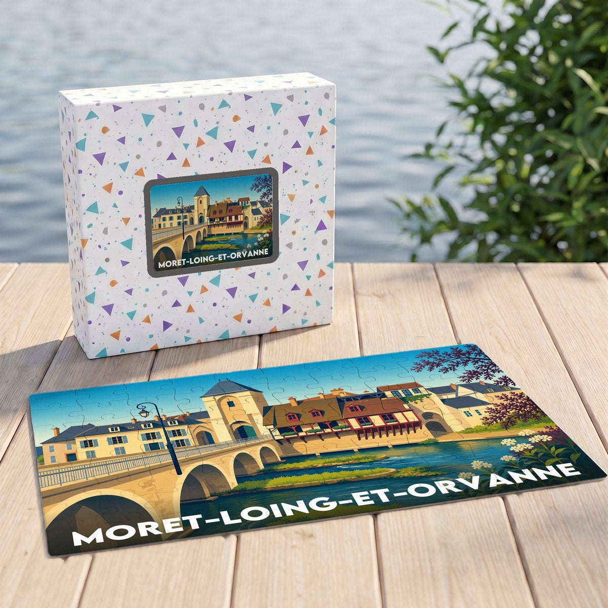 Puzzle souvenir de la ville de Moret-Loing-et-Orvanne avec une illustration stylisée de son pont et de ses maisons à colombages.