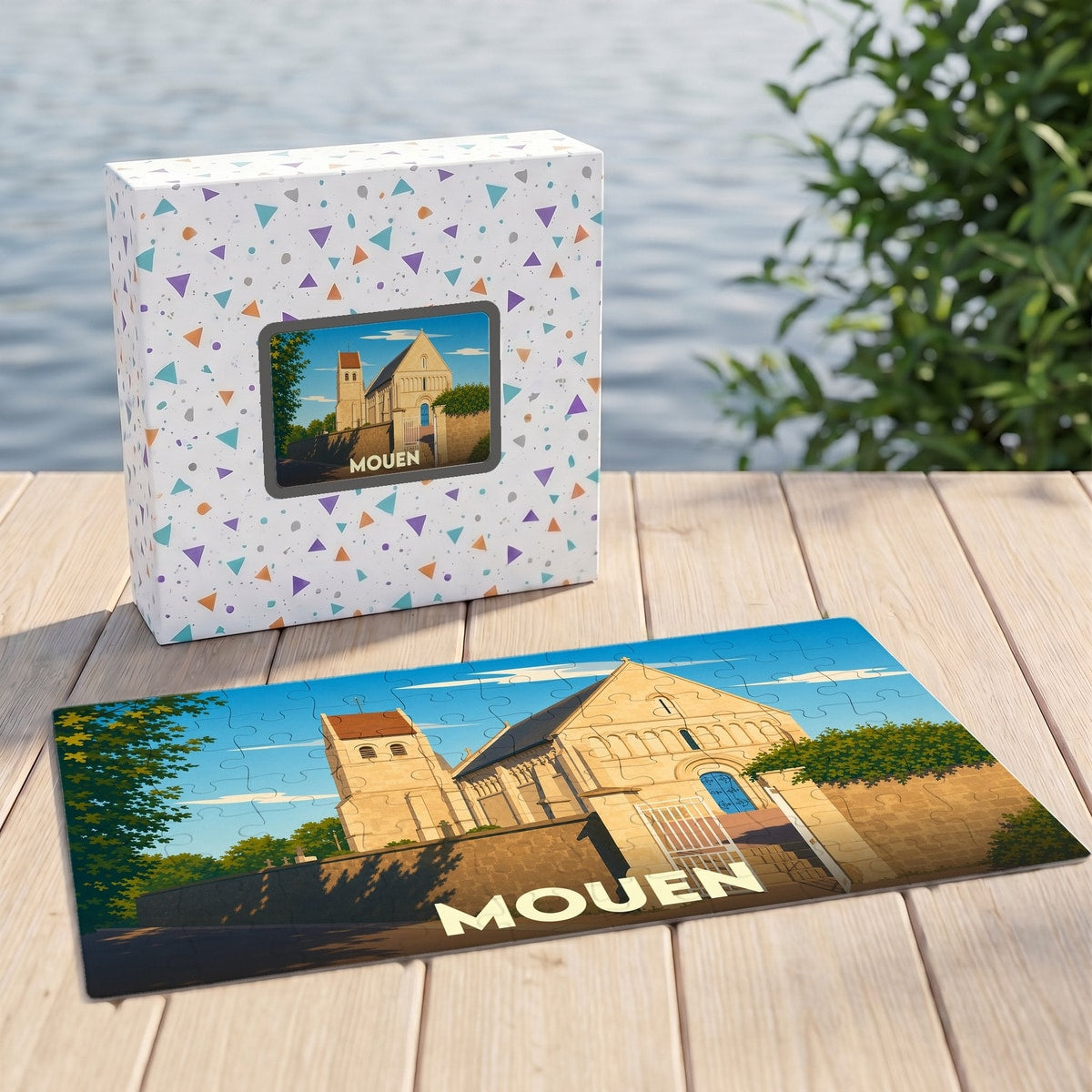 Puzzle souvenir de la ville de Mouen avec une illustration stylisée de son église.