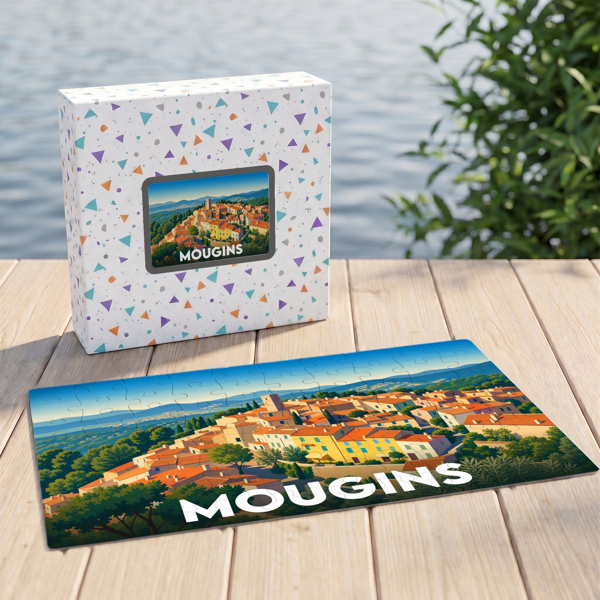 Puzzle souvenir de la ville de Mougins illustrant un paysage de village provençal avec sa boîte assortie.
