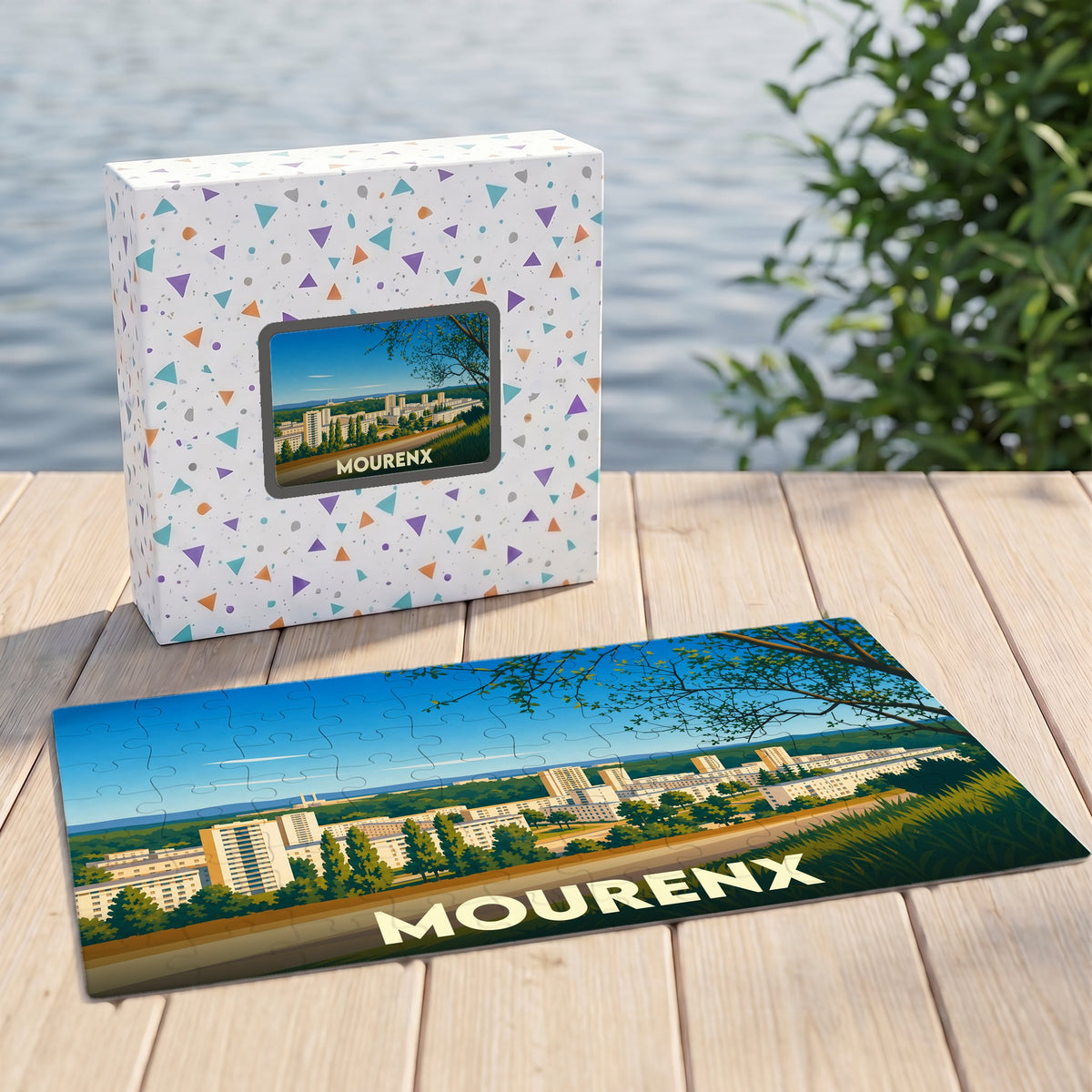 Puzzle souvenir de la ville de Mourenx avec une illustration panoramique stylisée dans sa boîte assortie.