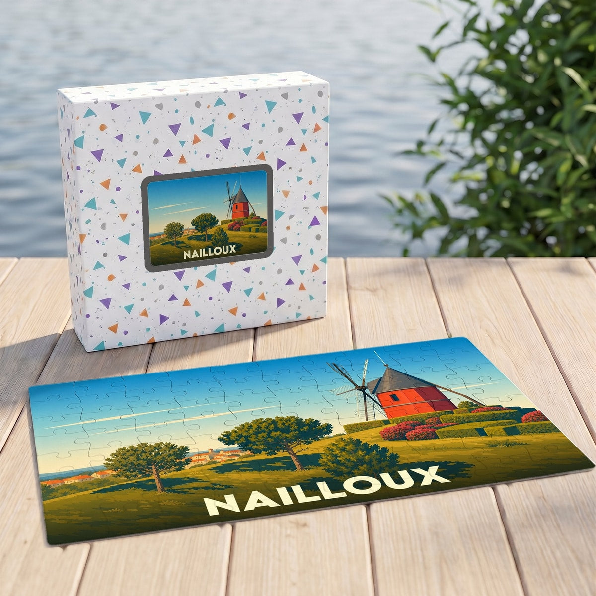 Puzzle souvenir de la ville de Nailloux avec une illustration stylisée d'un moulin rouge.