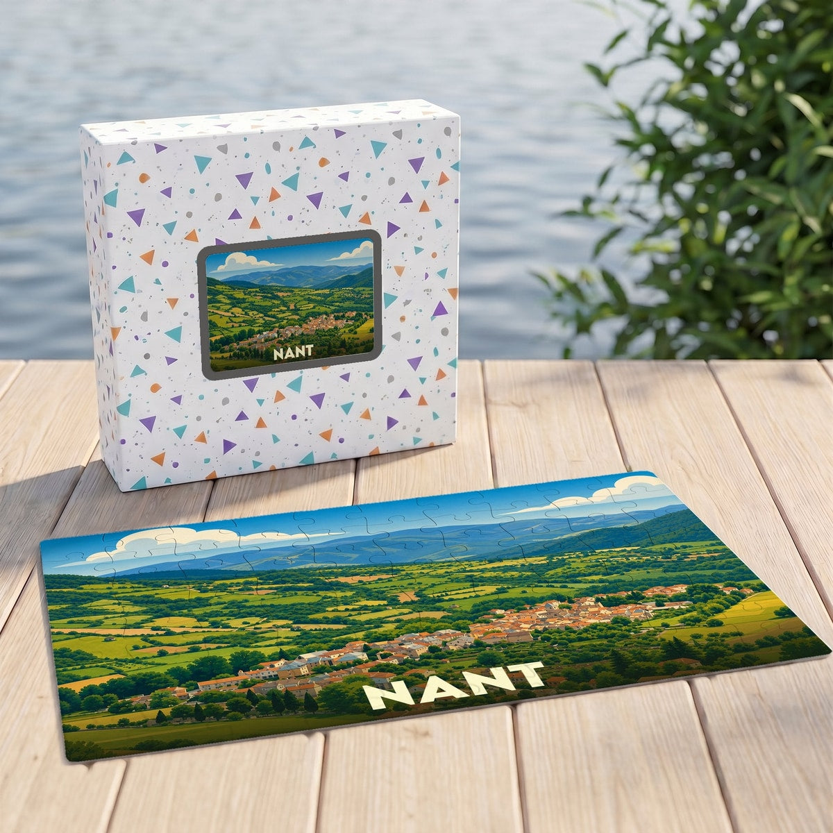 Puzzle souvenir de la ville de Nant avec une illustration panoramique de sa vallée verdoyante.