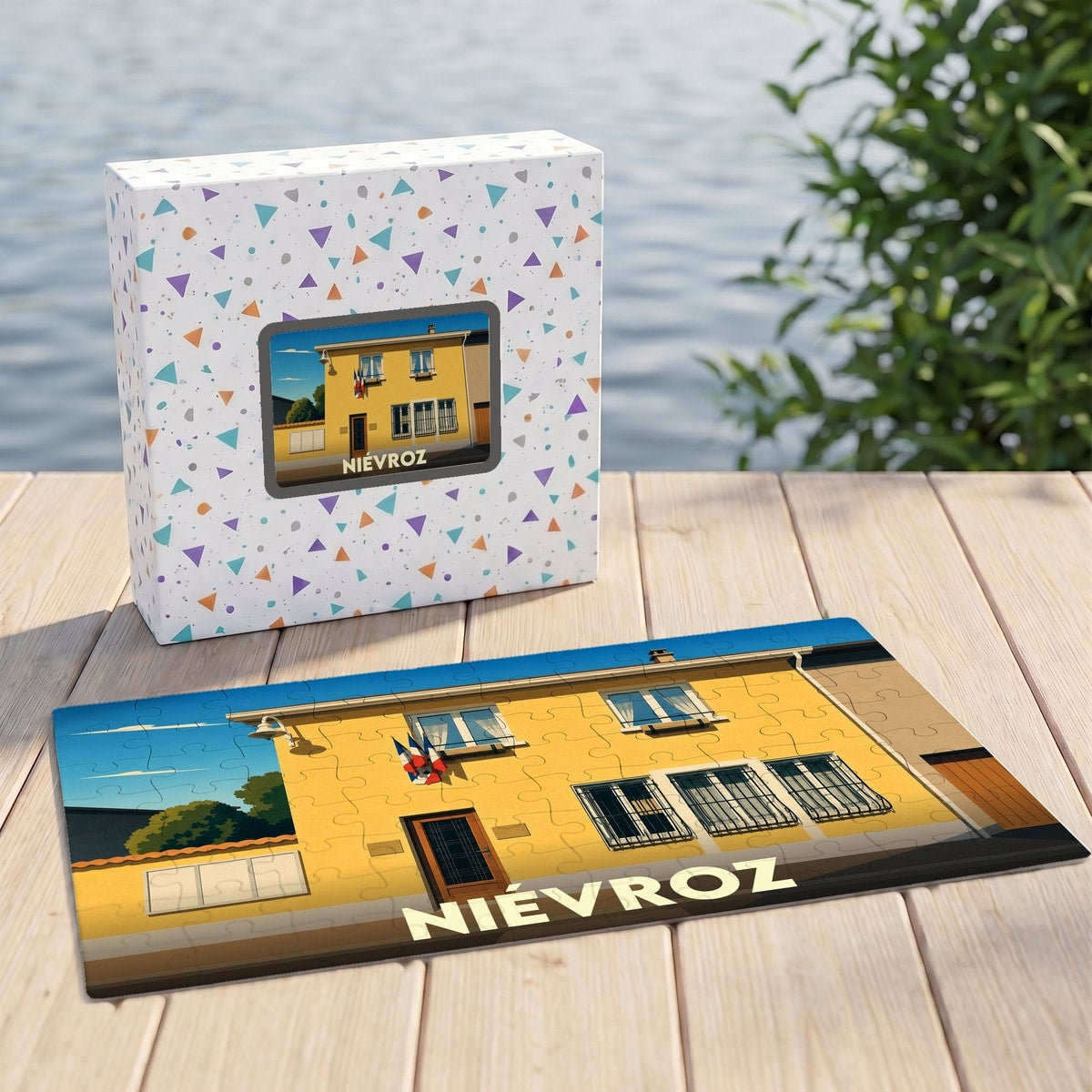 Puzzle souvenir de la ville de Niévroz avec une illustration stylisée d'un bâtiment jaune.