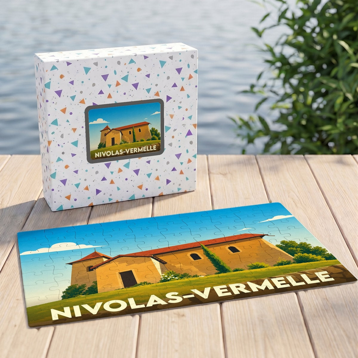 Puzzle souvenir de la ville de Nivolas-Vermelle avec une illustration stylisée d'un bâtiment provençal.