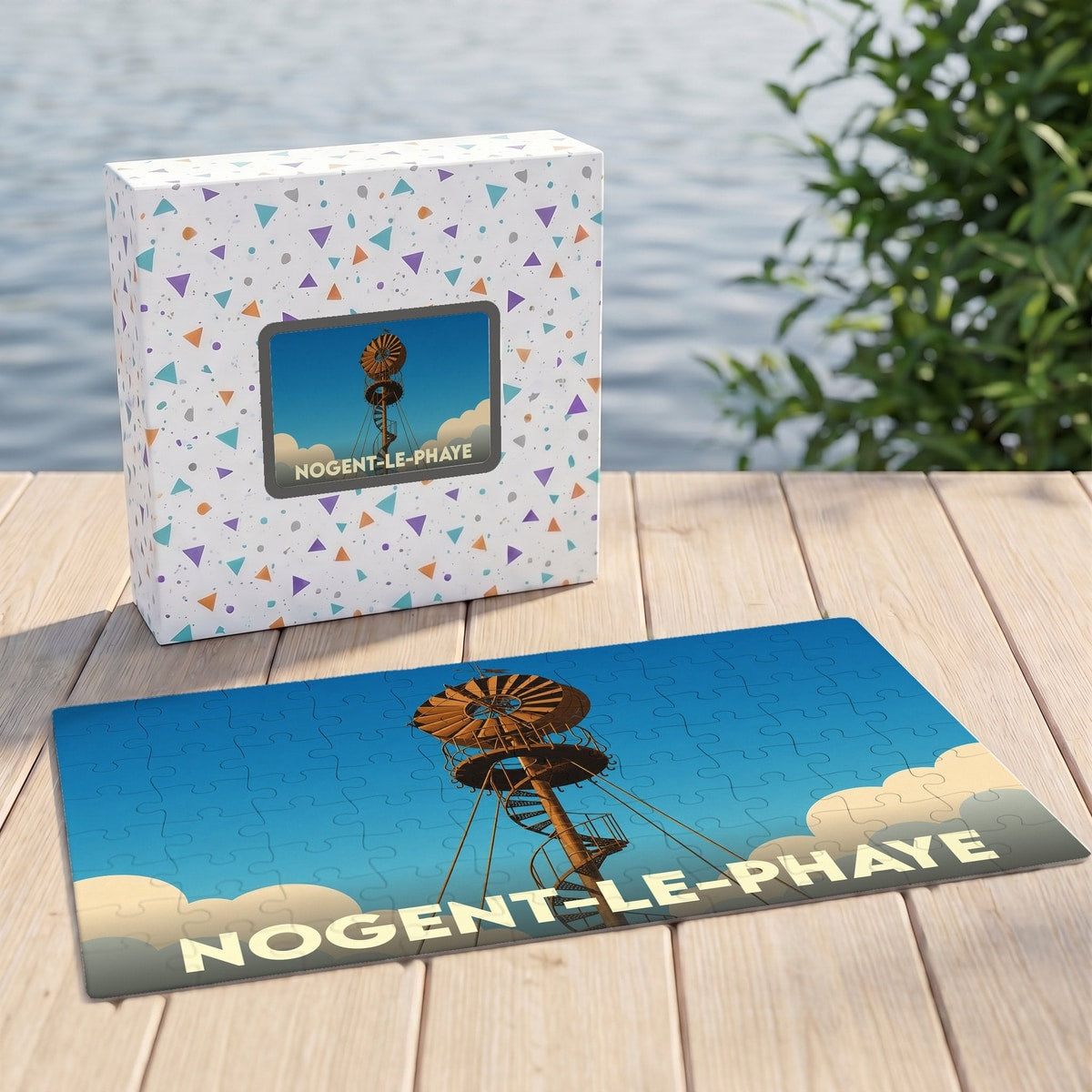 Puzzle souvenir de la ville de Nogent-le-Phaye illustré par un moulin à vent stylisé.