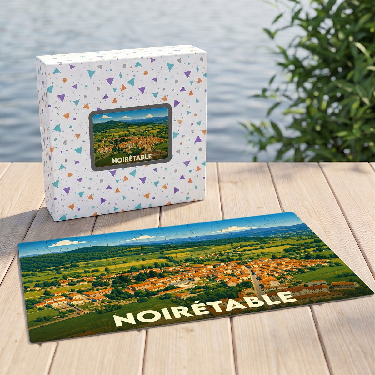 Puzzle souvenir de la ville de Noirétable avec une illustration de son paysage rural.