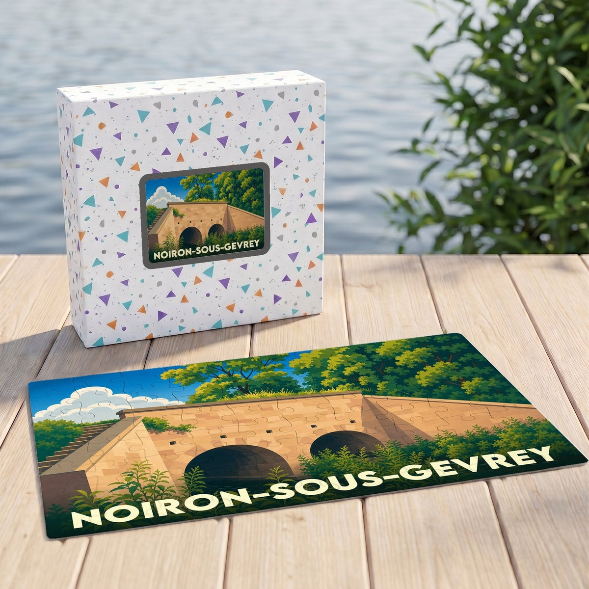 Puzzle souvenir de la ville de Noiron-sous-Gevrey avec une illustration stylisée d'un pont en pierre.