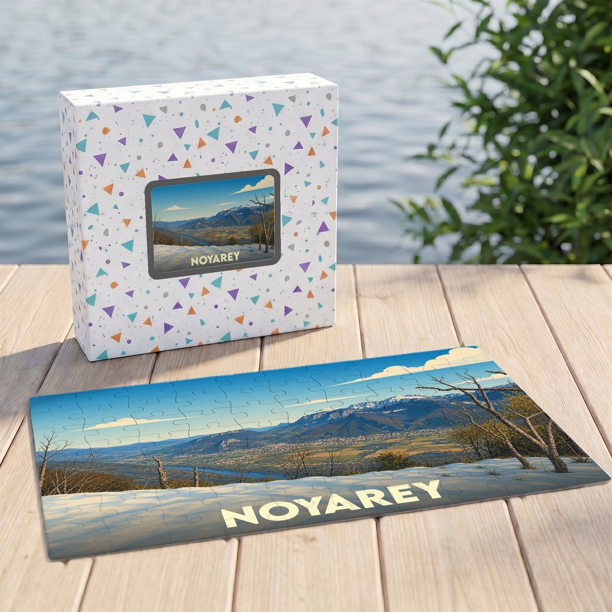 Puzzle souvenir de la ville de Noyarey avec une illustration de paysage montagneux.