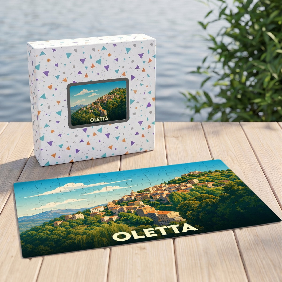 Puzzle souvenir de la ville d'Oletta représentant un village perché dans un paysage verdoyant.