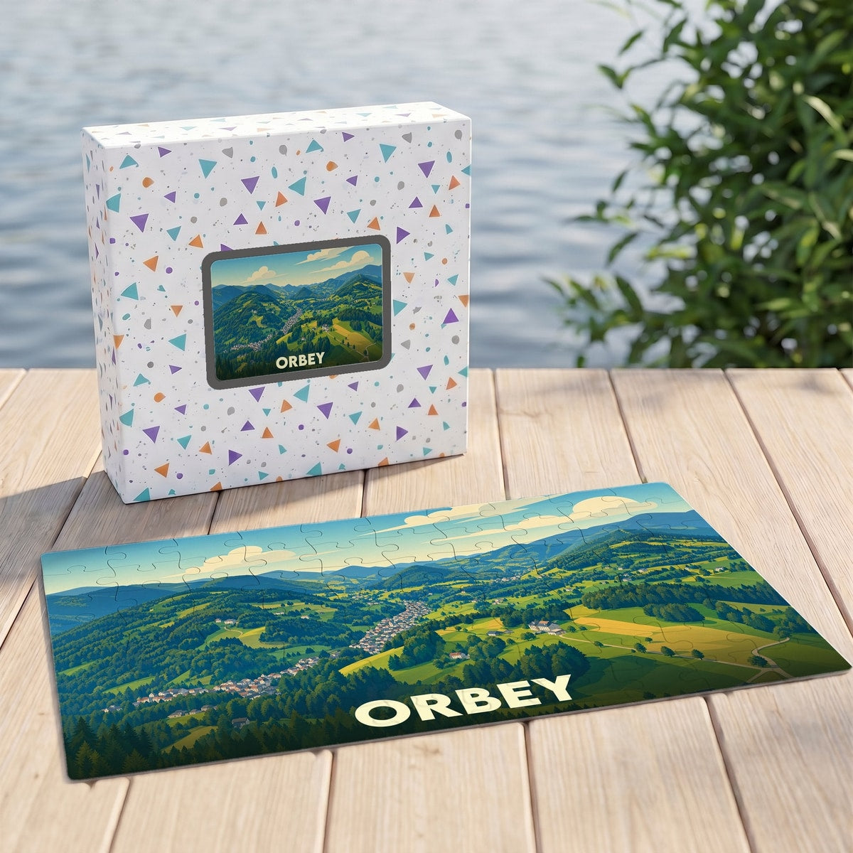 Puzzle souvenir de la ville d'Orbey avec une illustration panoramique de ses paysages verdoyants.