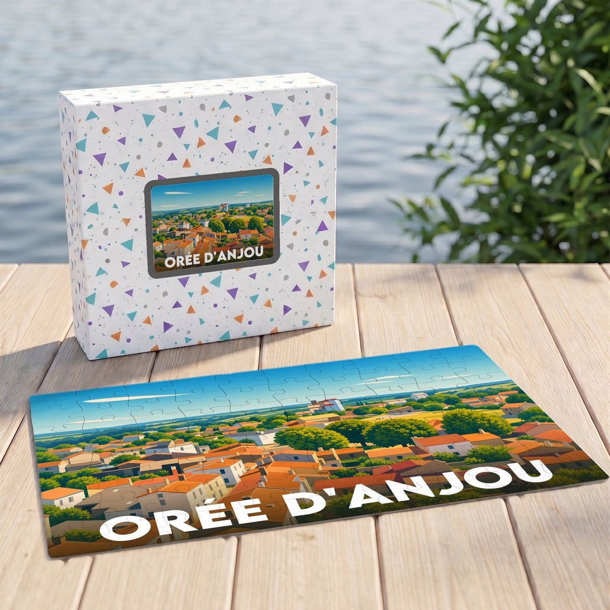 Puzzle souvenir de la ville d'Orée d'Anjou avec une illustration paysagère stylisée.