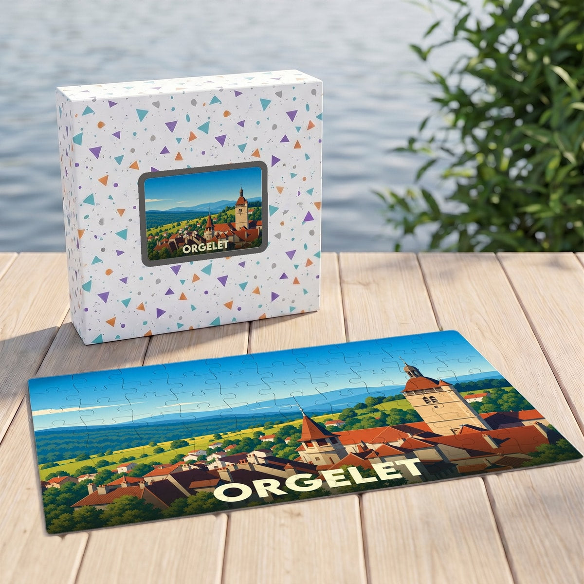Puzzle souvenir de la ville d'Orgelet avec une illustration panoramique stylisée.