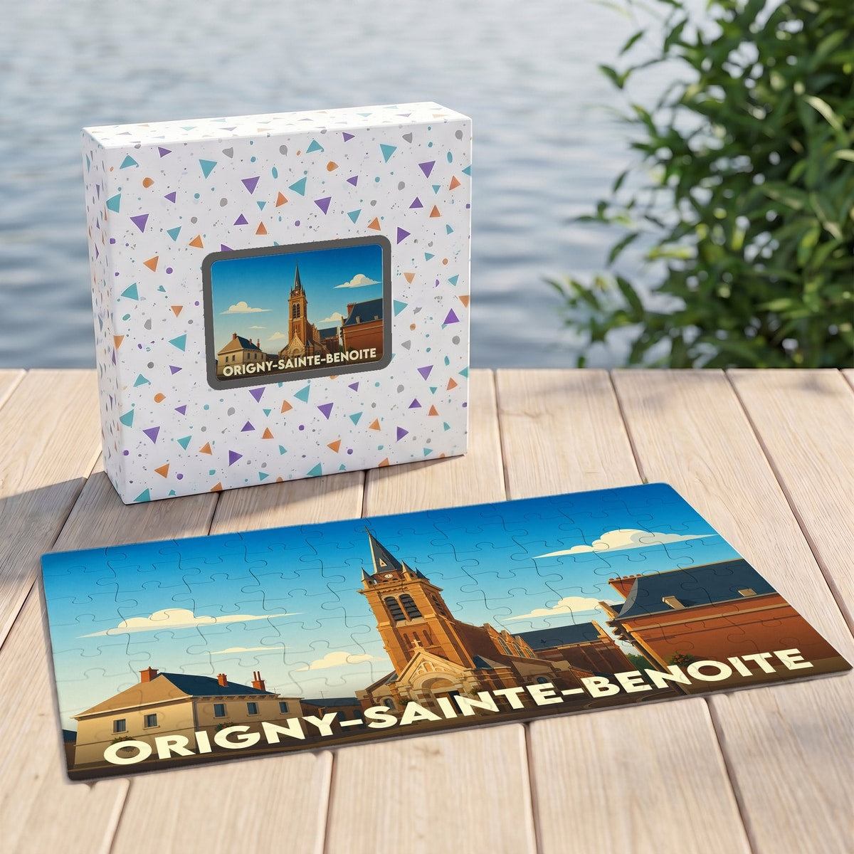 Puzzle souvenir de la commune d’Origny-Sainte-Benoite avec une illustration stylisée de son église.