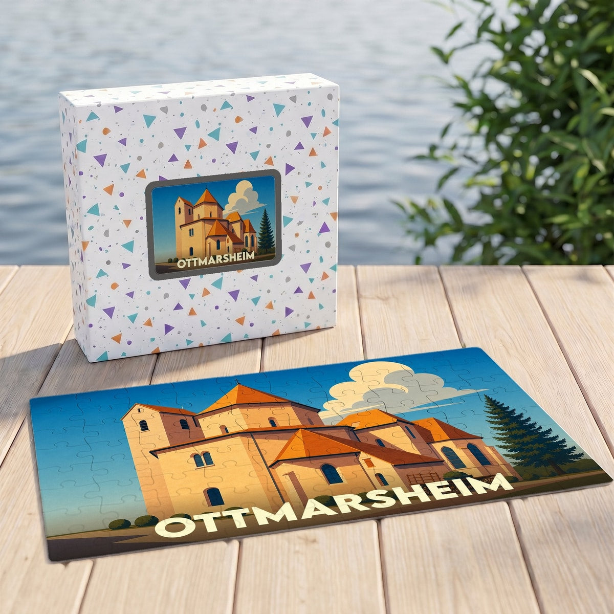 Puzzle souvenir de la ville d'Ottmarsheim avec une illustration stylisée de son église abbatiale.