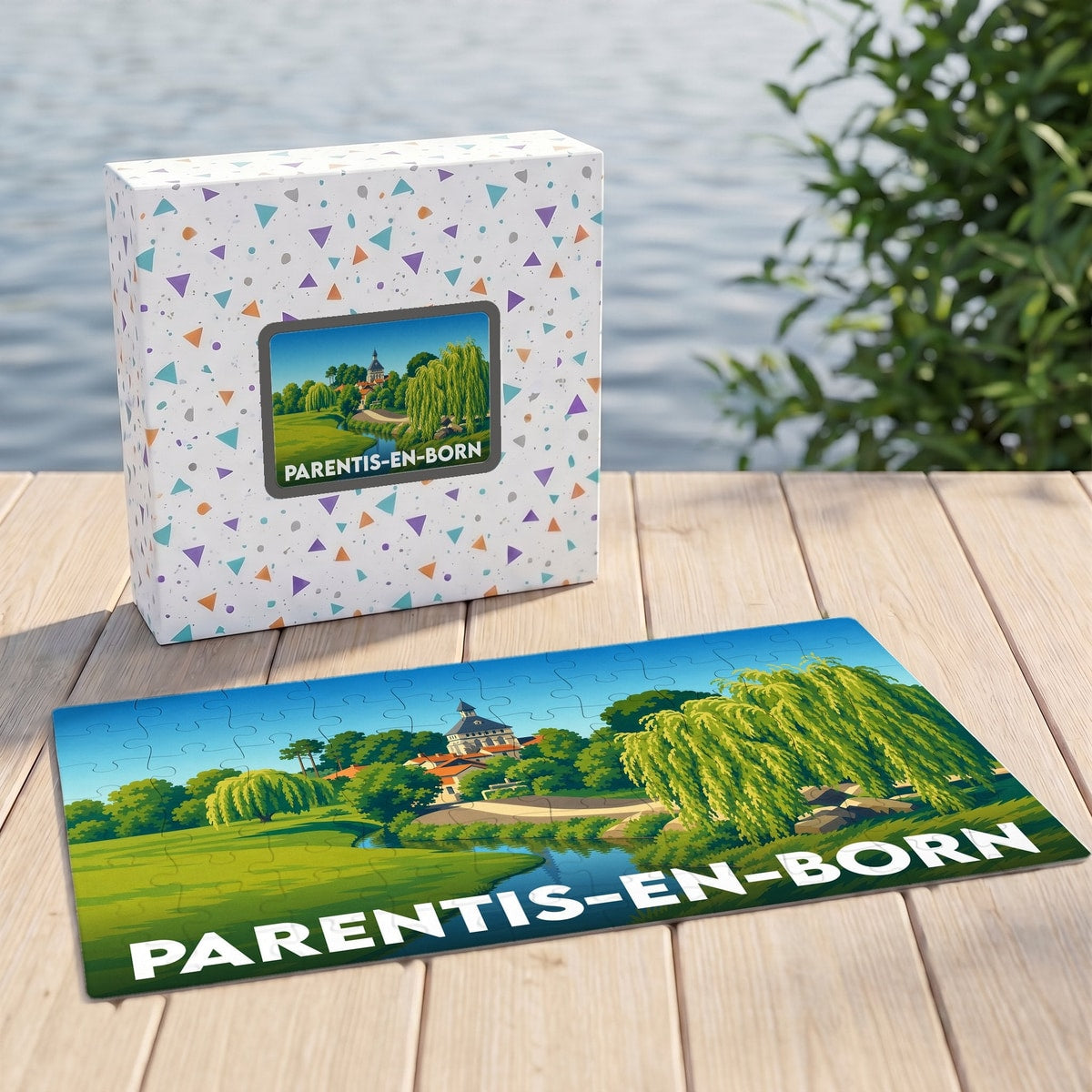 Puzzle souvenir de la ville de Parentis-en-Born avec son coffret et une illustration stylisée d'un paysage lacustre.