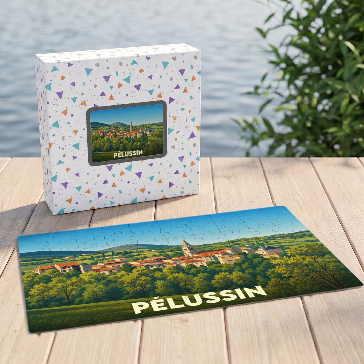 Puzzle souvenir de la ville de Pélussin présentant une illustration panoramique et colorée du village.
