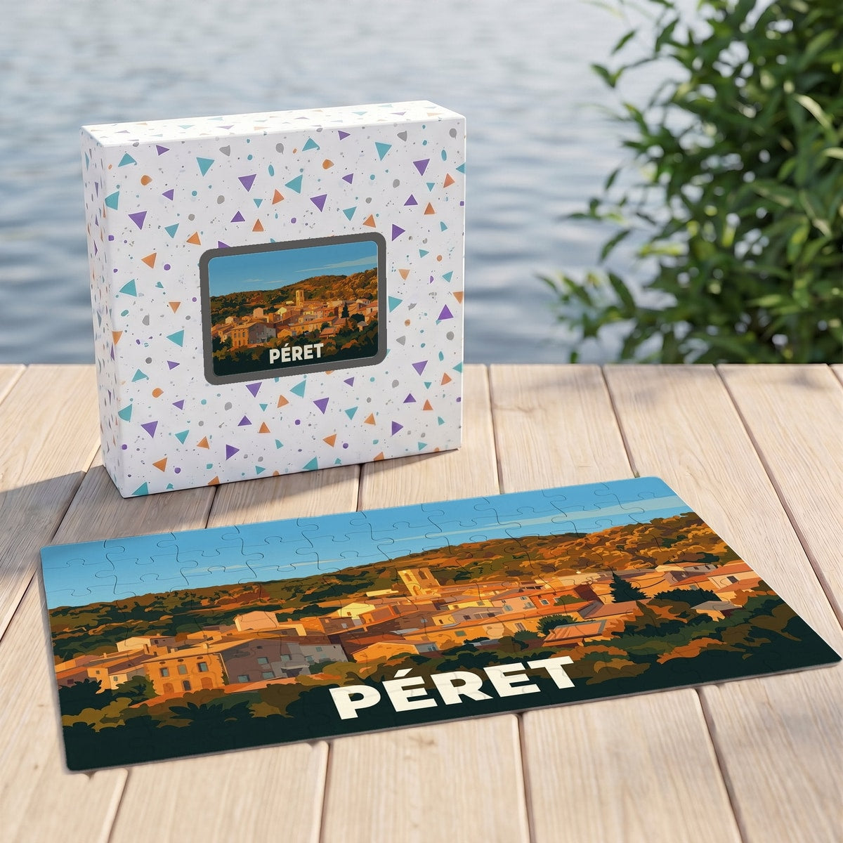 Puzzle souvenir de la ville de Péret avec une illustration stylisée et colorée.