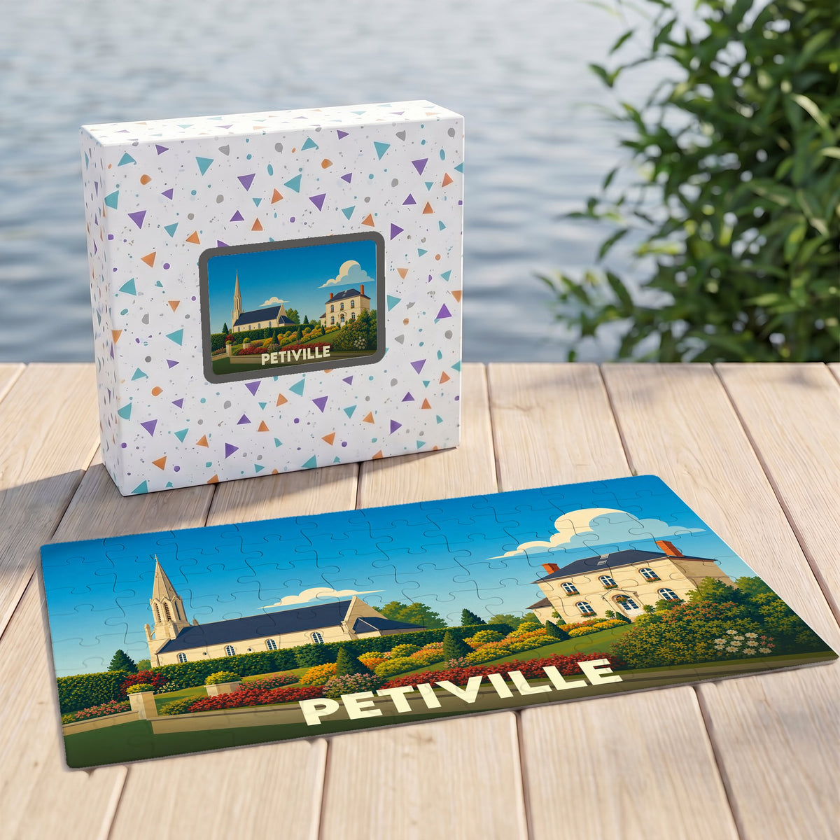 Puzzle souvenir de la ville de Petiville illustrant un paysage coloré avec son église et ses maisons.
