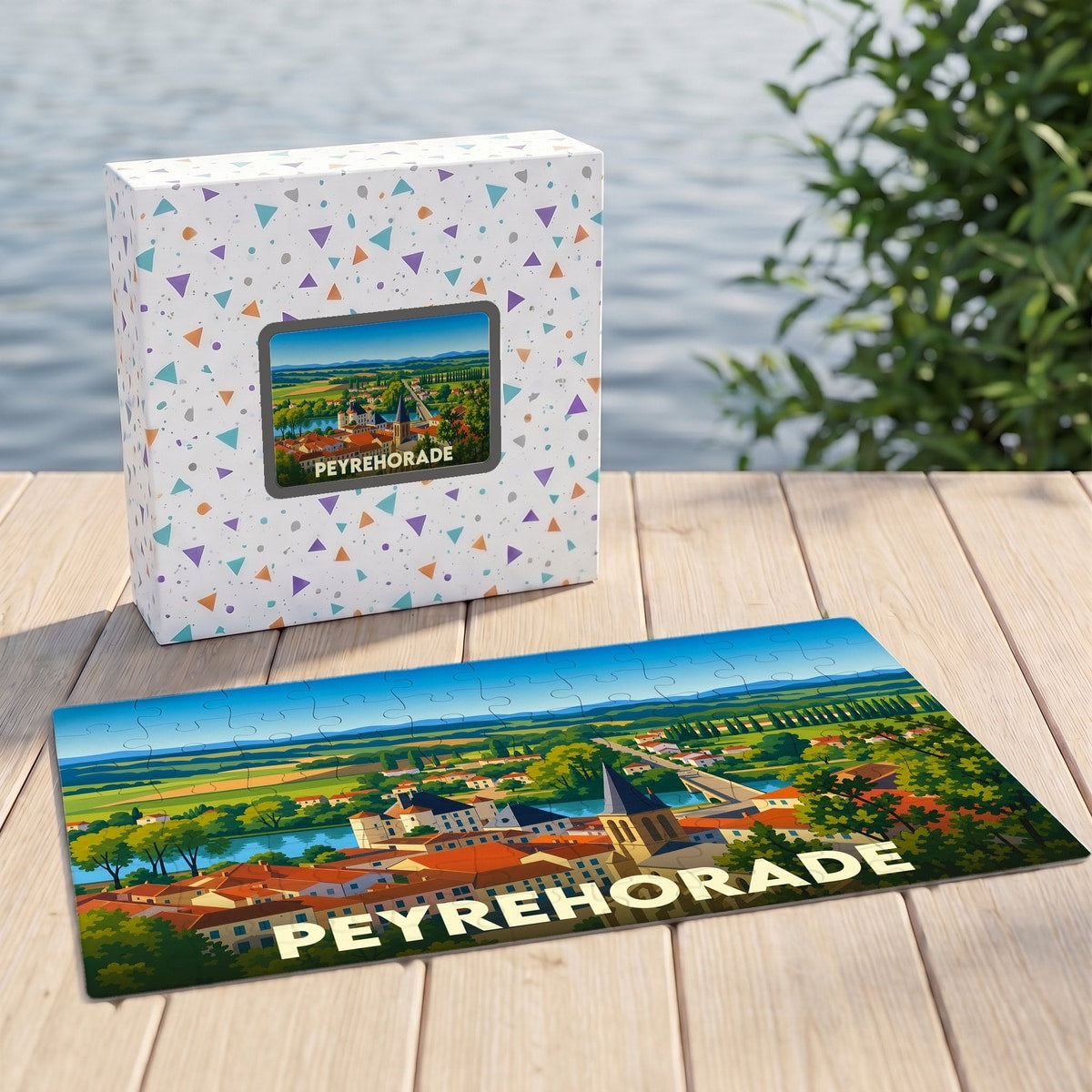 Puzzle souvenir de la ville de Peyrehorade avec une illustration stylisée d'un paysage urbain au bord de l'eau.