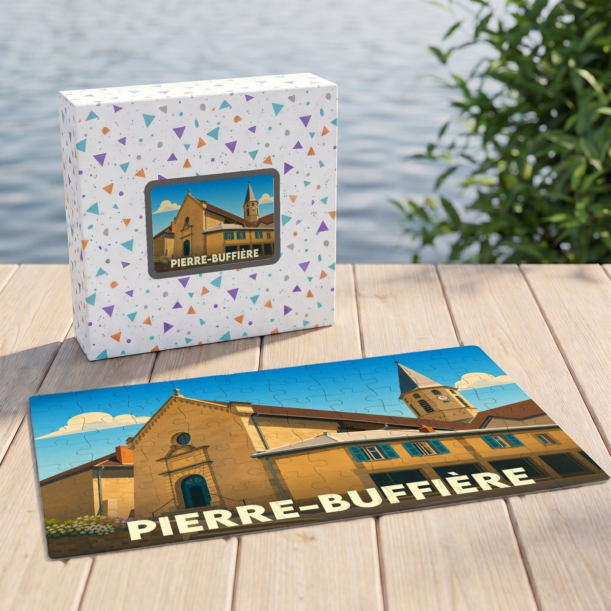 Puzzle souvenir de la ville de Pierre-Buffière avec une illustration stylisée d'un bâtiment historique et son clocher.