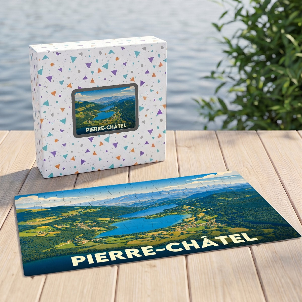 Puzzle souvenir de la ville de Pierre-Châtel illustrant un paysage de lacs et de montagnes.
