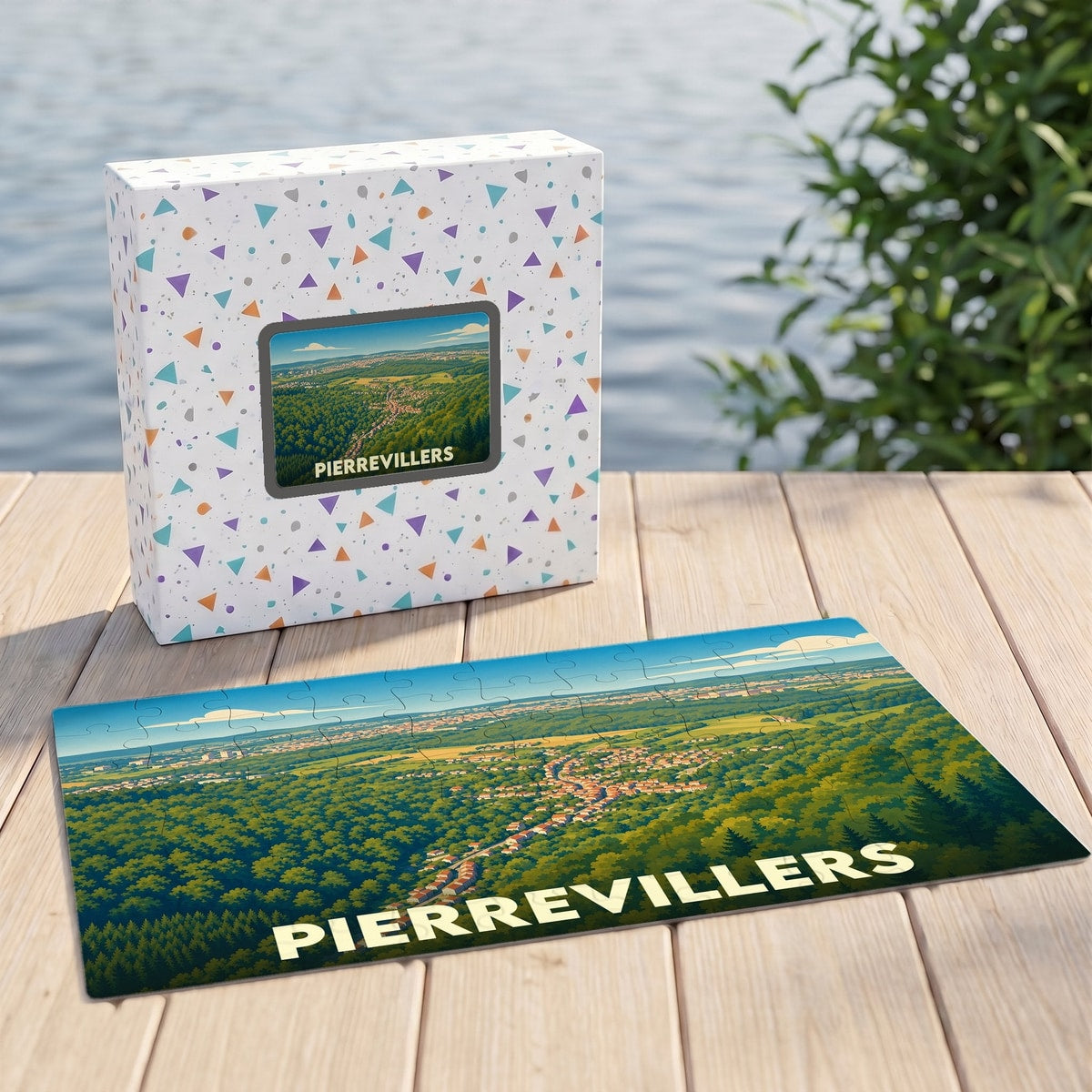 Puzzle souvenir de la ville de Pierrevillers présentant une vue aérienne illustrée de la commune au milieu de la forêt.