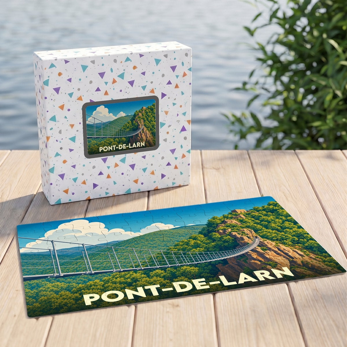 Puzzle souvenir de la ville de Pont-de-Larn avec une illustration stylisée d'une passerelle suspendue.