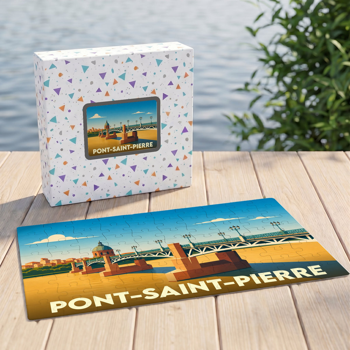 Puzzle souvenir de la ville de Pont-Saint-Pierre avec une illustration stylisée d'un pont et son coffret assorti.