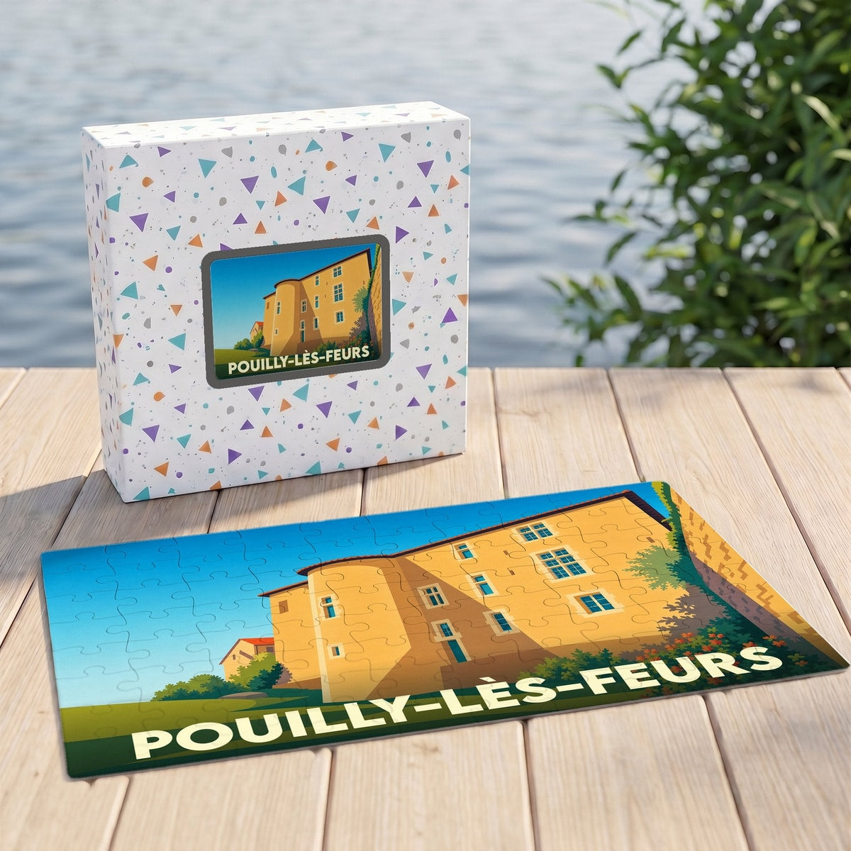 Puzzle souvenir de la ville de Pouilly-lès-Feurs avec une illustration stylisée d'un bâtiment historique.