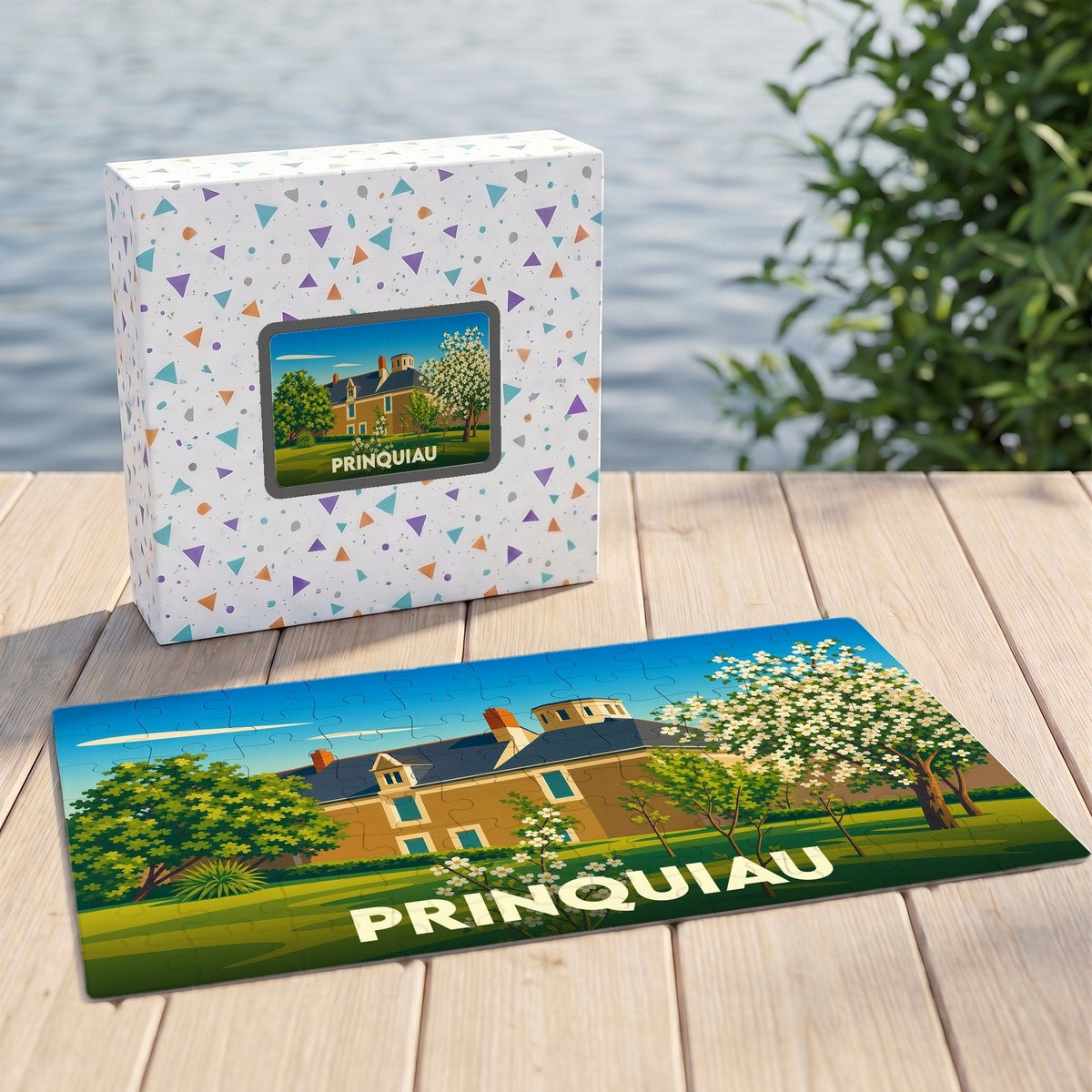 Puzzle souvenir de la ville de Prinquiau avec une illustration stylisée d'un manoir fleuri.