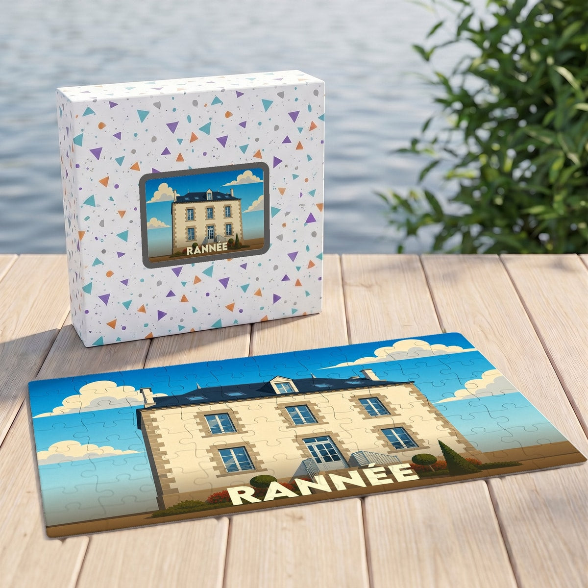 Puzzle souvenir de la ville de Rannée avec une illustration stylisée d'une maison de maître.