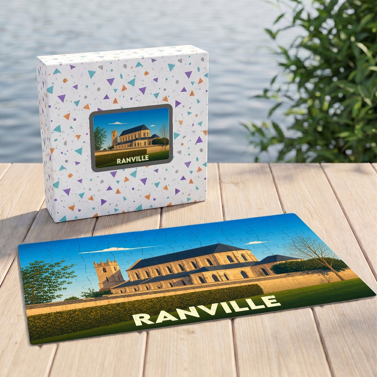 Puzzle souvenir de la ville de Ranville illustrant une église ancienne dans un style épuré.