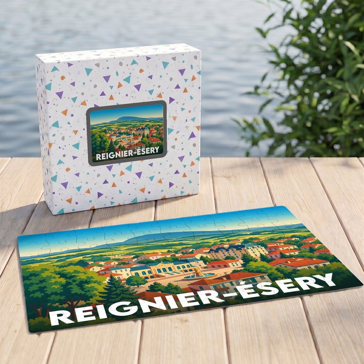 Puzzle souvenir de la ville de Reignier-Ésery avec une illustration stylisée d'un paysage urbain.