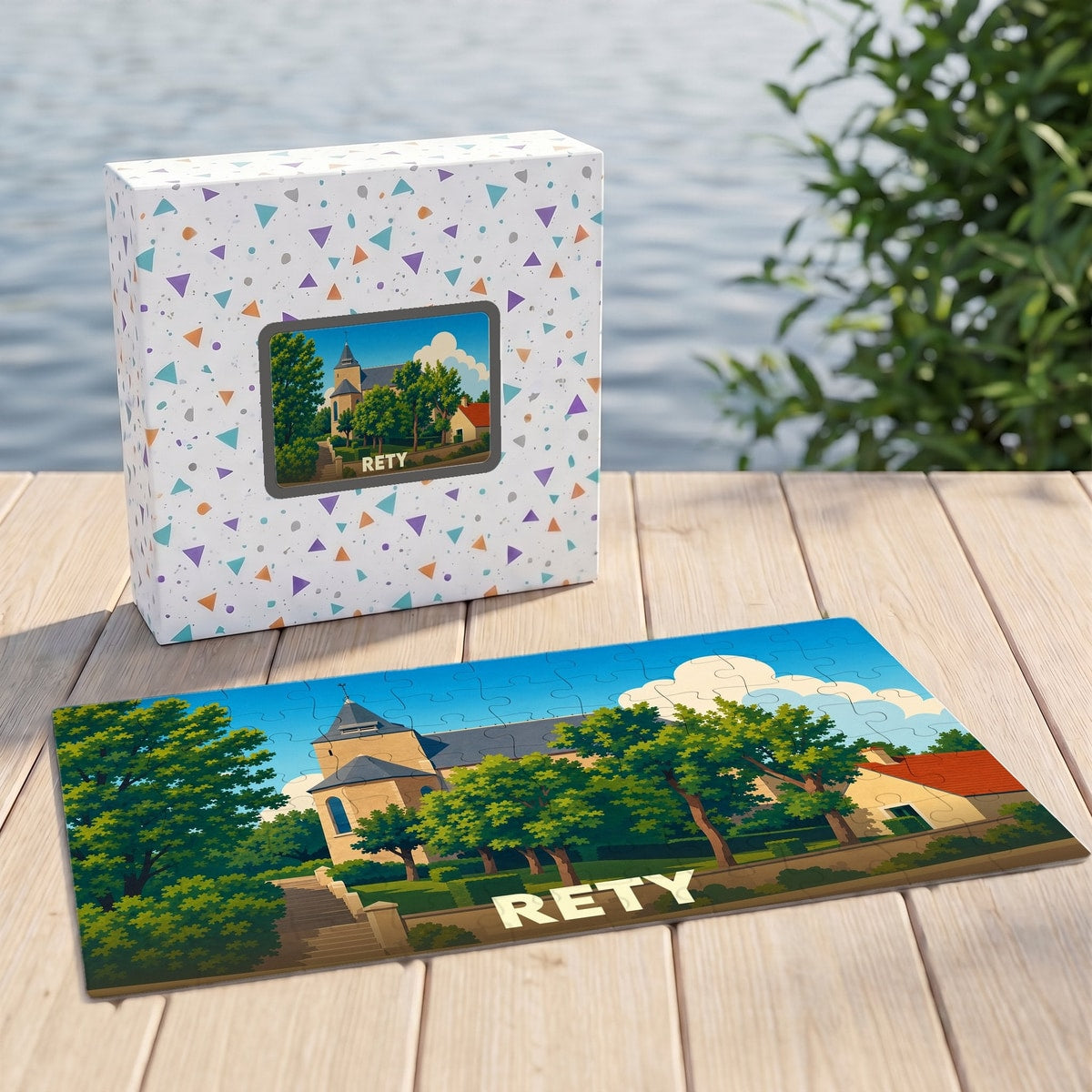 Puzzle souvenir de la ville de Rety avec une illustration stylisée de son église et de ses paysages.