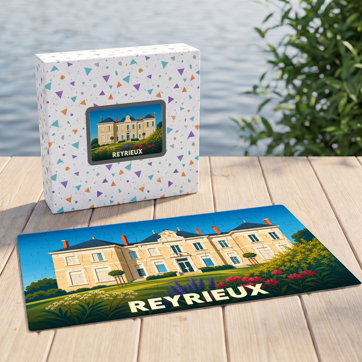 Puzzle souvenir de la ville de Reyrieux avec une illustration stylisée d'un château.