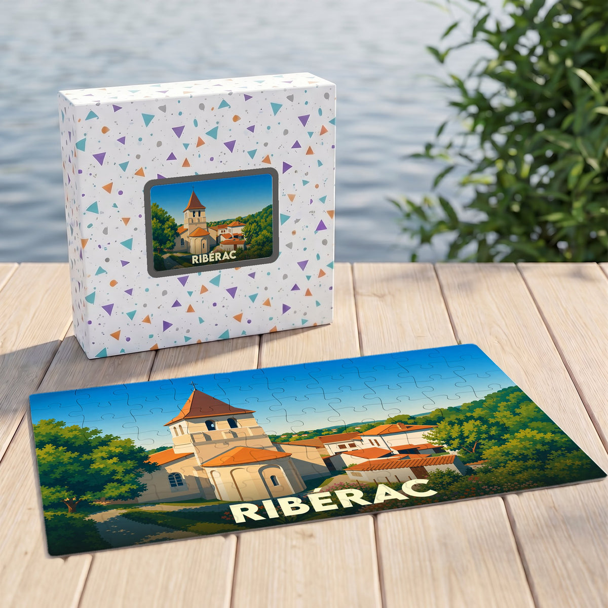Puzzle souvenir de la ville de Ribérac illustré par un dessin stylisé de son église et de ses environs.
