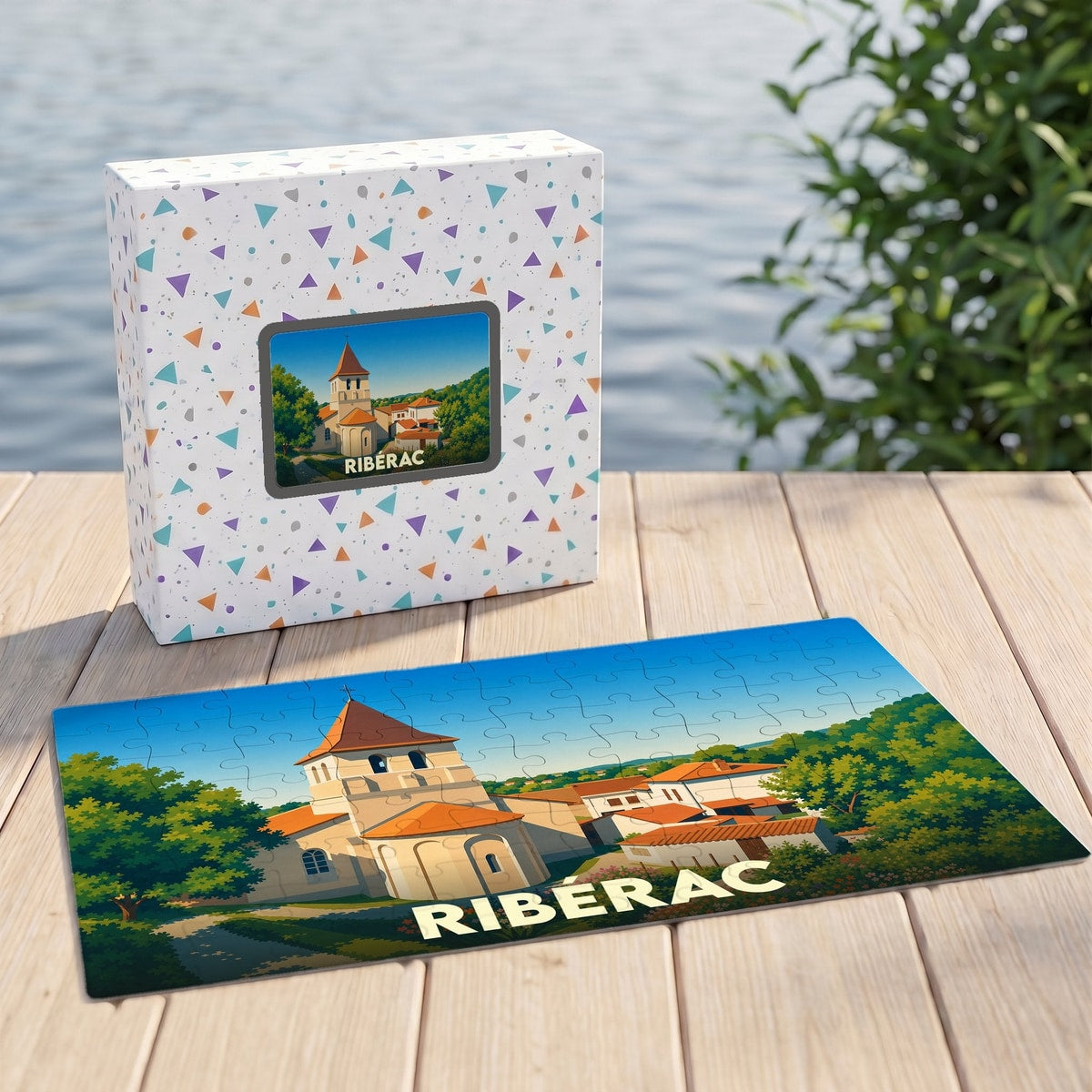 Puzzle souvenir de la ville de Ribérac illustré par un dessin stylisé de son église et de ses environs.