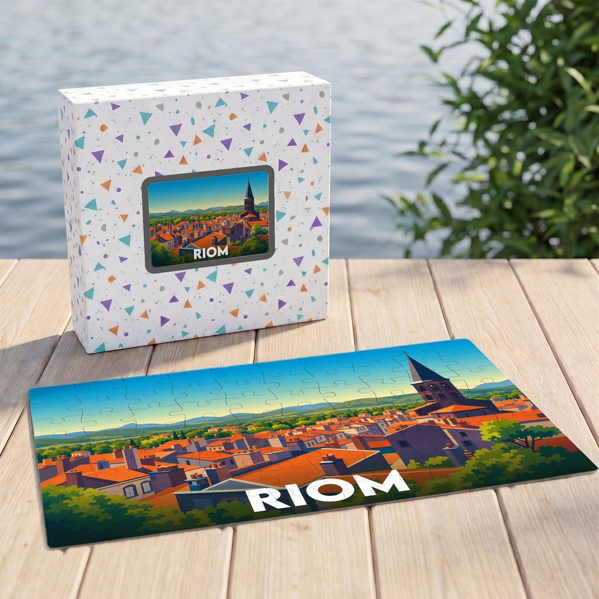 Puzzle souvenir de la ville de Riom avec une illustration stylisée de ses toits rouges et de son clocher.