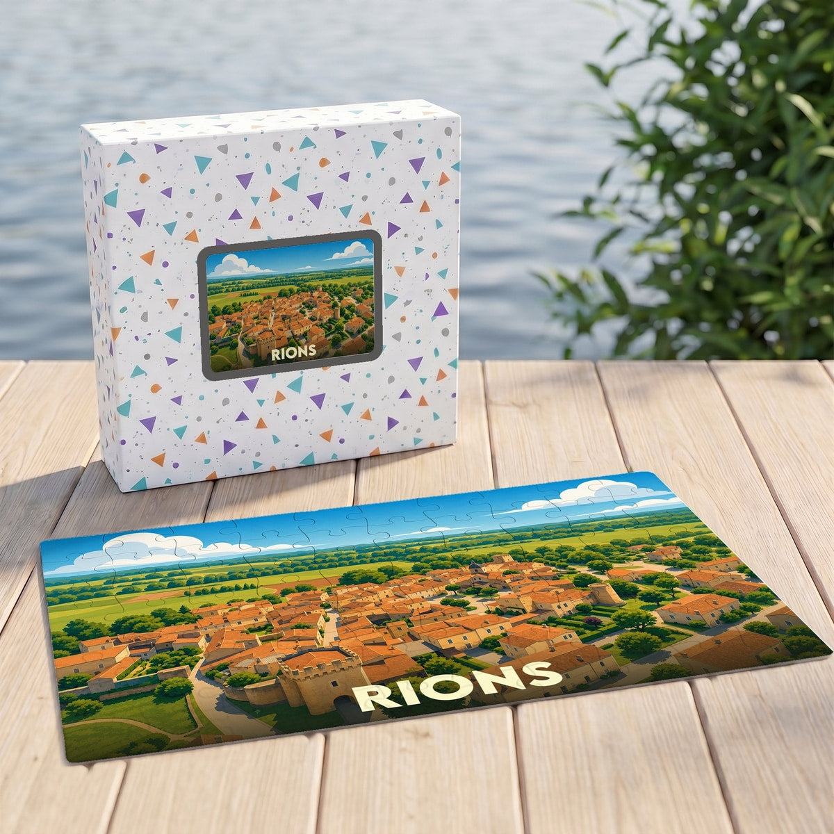 Puzzle souvenir de la ville de Rions représentant une vue aérienne illustrée du village.
