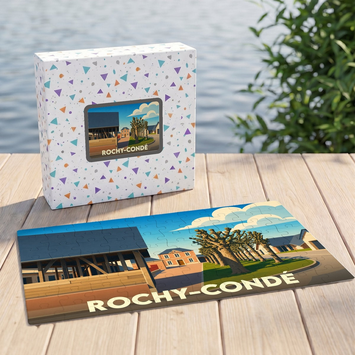 Puzzle souvenir de la ville de Rochy-Condé avec une illustration stylisée d'un paysage urbain.