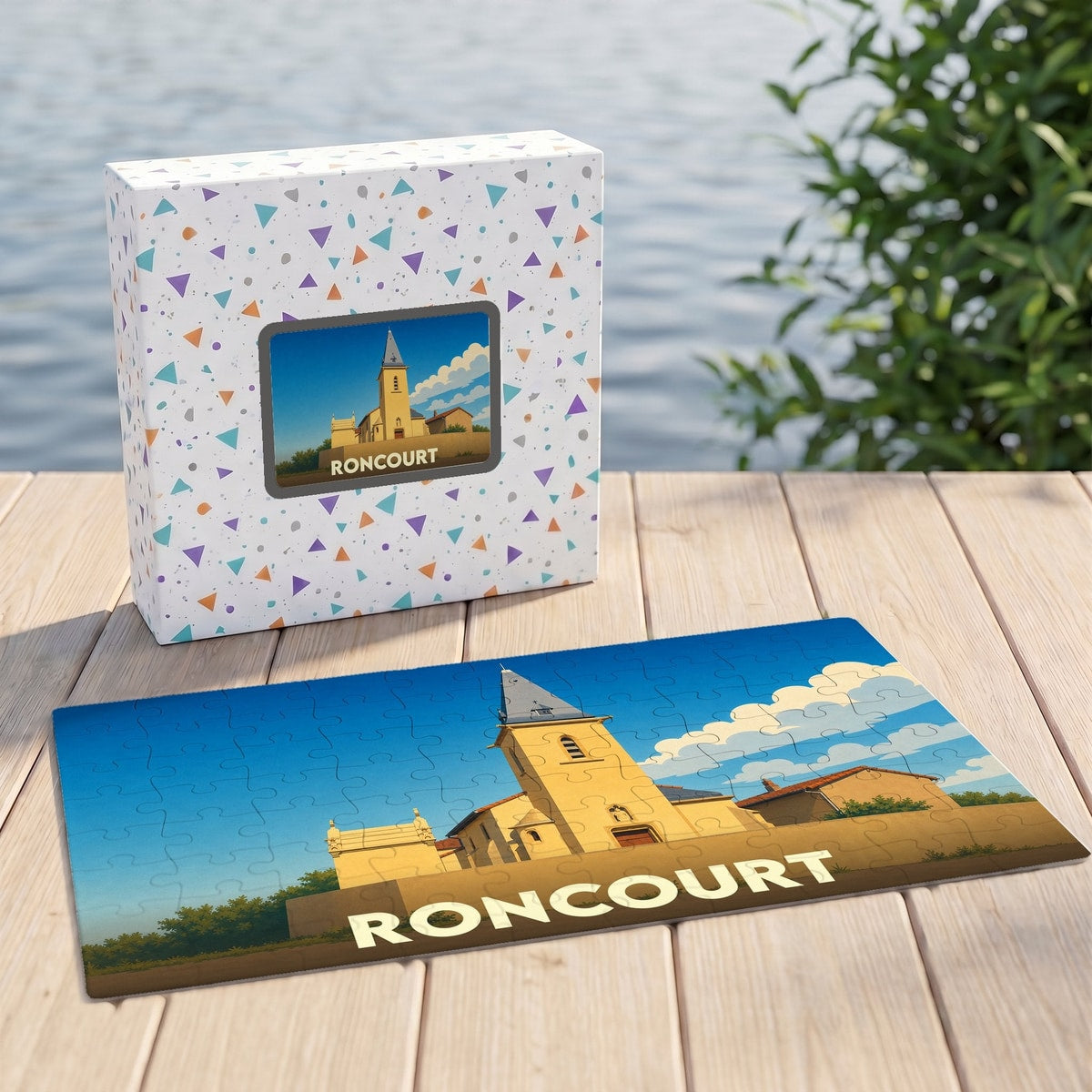 Puzzle souvenir de la ville de Roncourt présentant une illustration stylisée de son église sur sa boîte et en version assemblée.