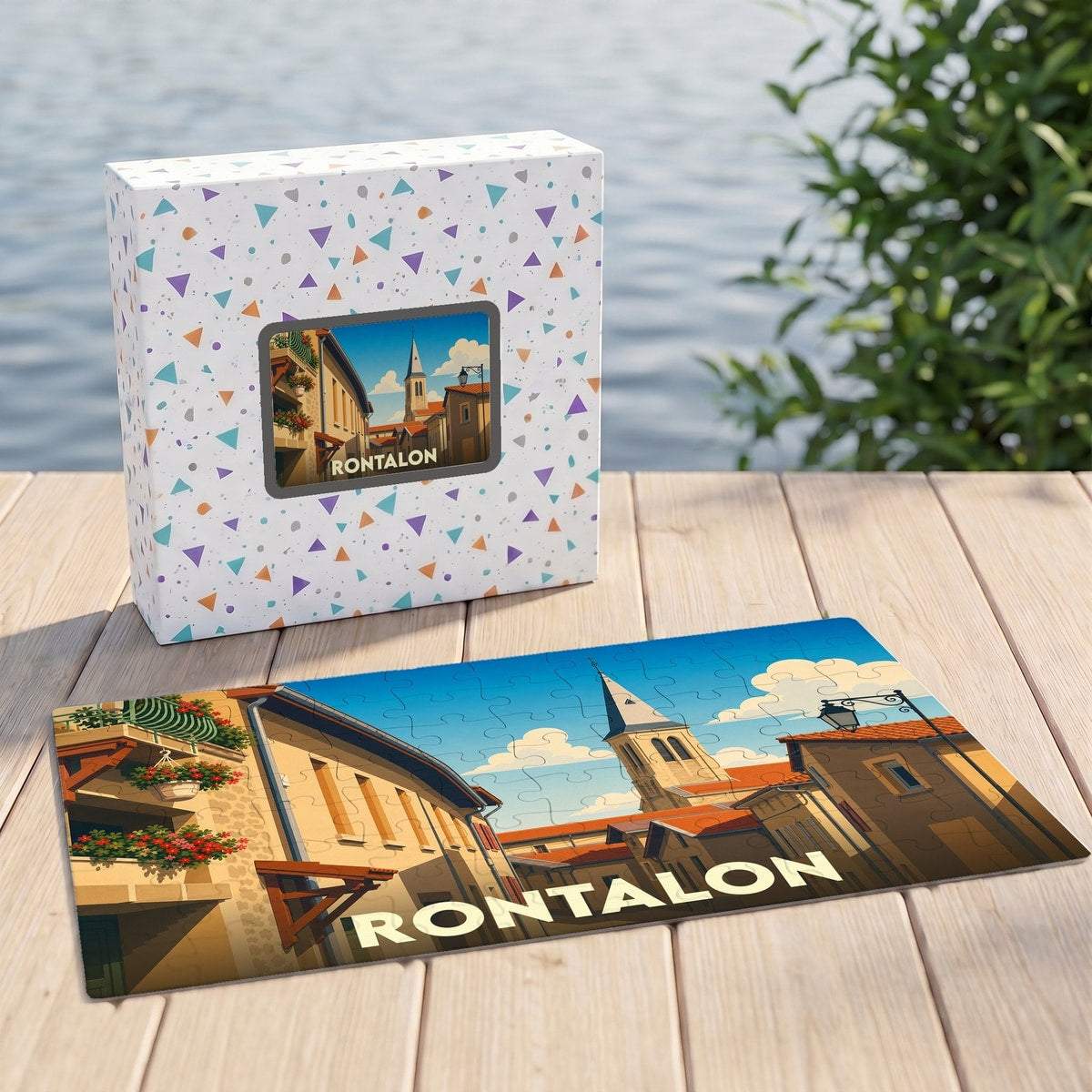 Puzzle souvenir de la commune de Rontalon avec une illustration stylisée d'une rue du village et son clocher.