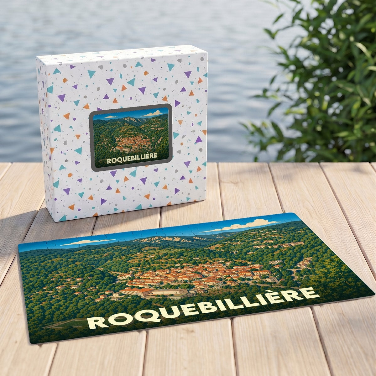 Puzzle souvenir de la ville de Roquebillière avec une illustration panoramique stylisée.