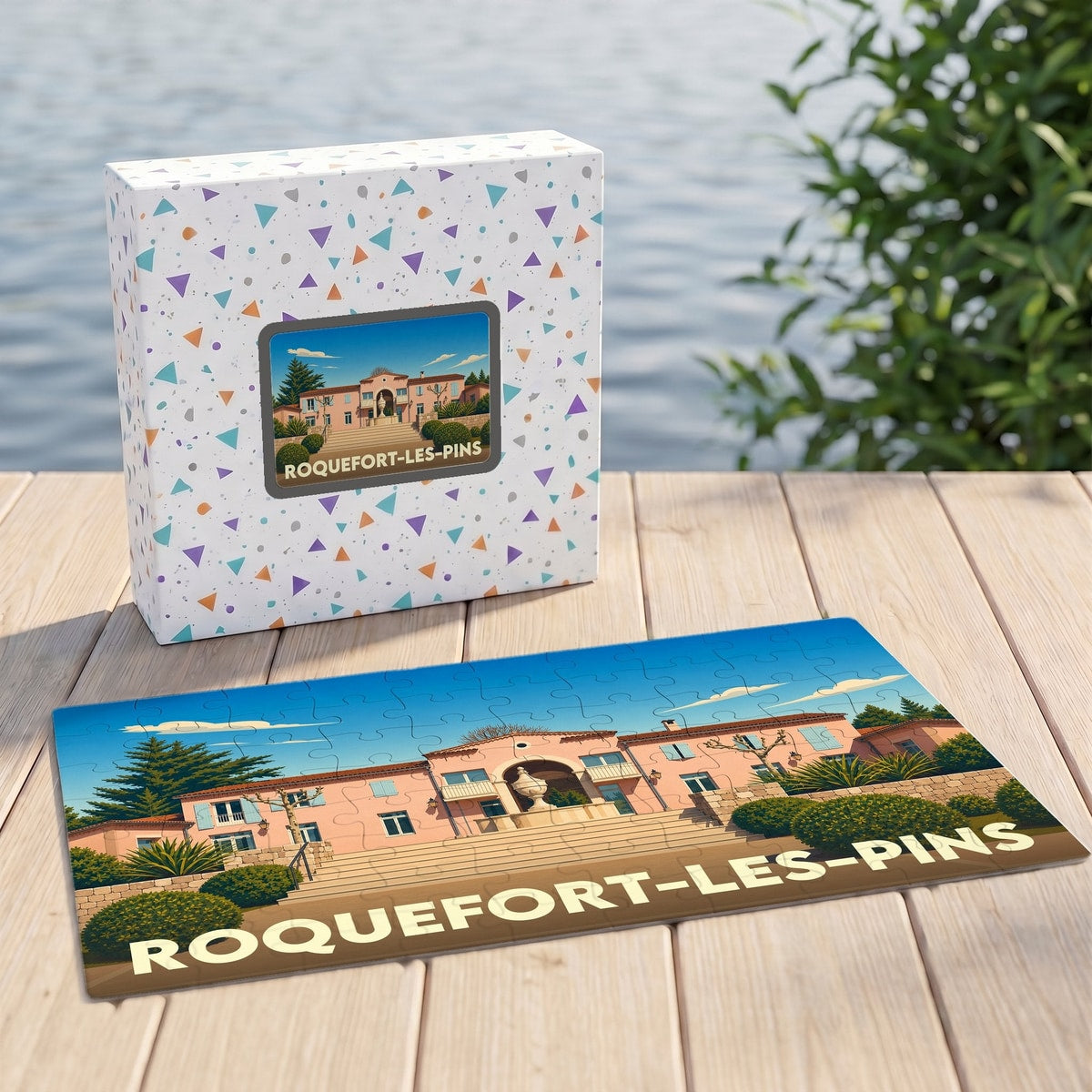 Puzzle souvenir de la ville de Roquefort-les-Pins illustré par un panorama stylisé de son architecture.