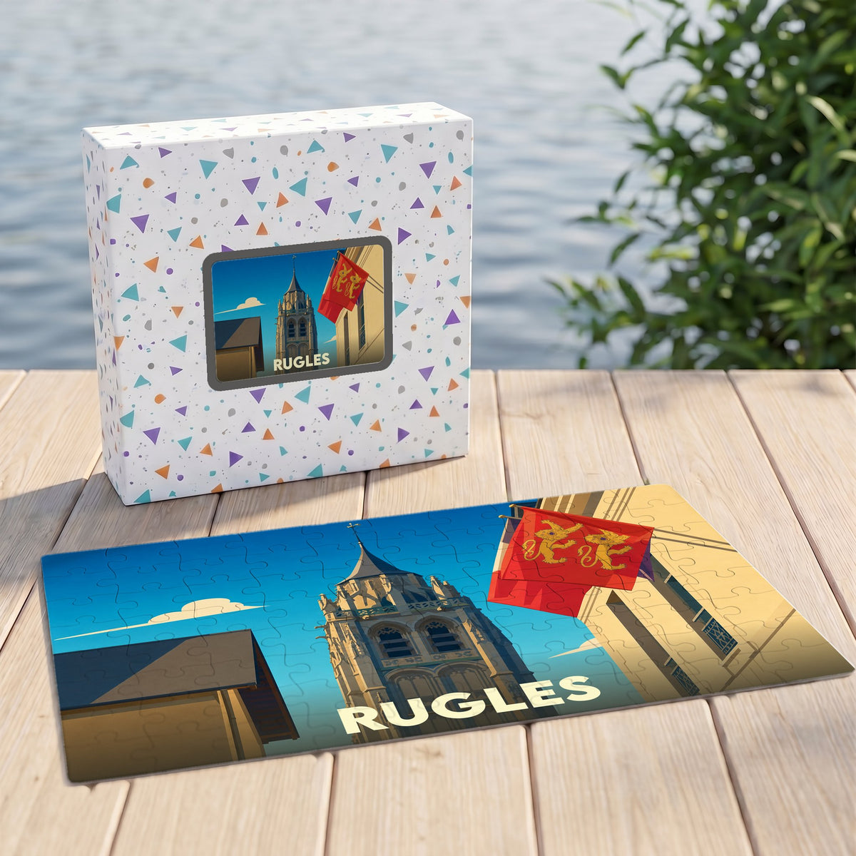 Puzzle souvenir de la ville de Rugles avec une illustration stylisée de son église et de drapeaux normands.